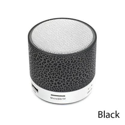 Black and white portable speaker on a white background
