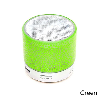 Green portable speaker on a white background
