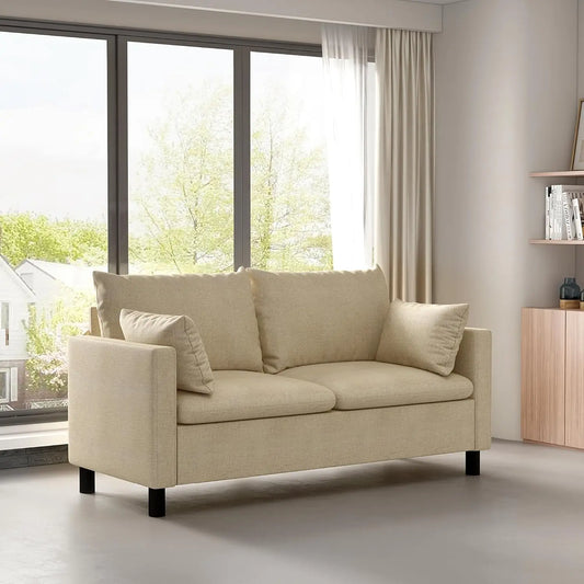 Beige sofa in a modern living room with large windows and a wooden cabinet.