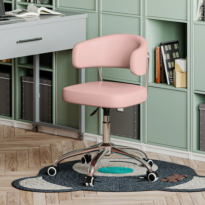 Pink office chair in a home office setting with green cabinets and a desk.