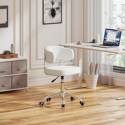 White office chair in a modern office setting with a desk and laptop.