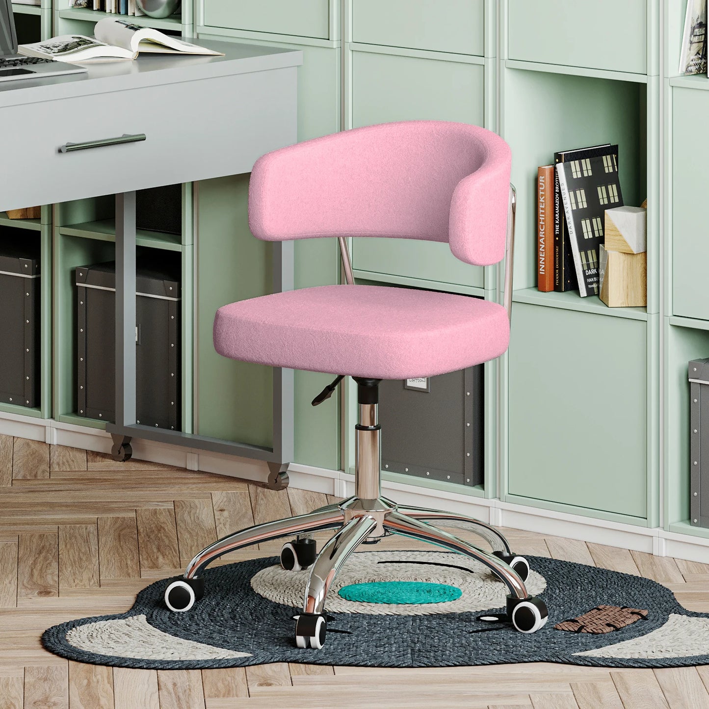 Pink office chair in a home office setting with a desk and bookshelves.