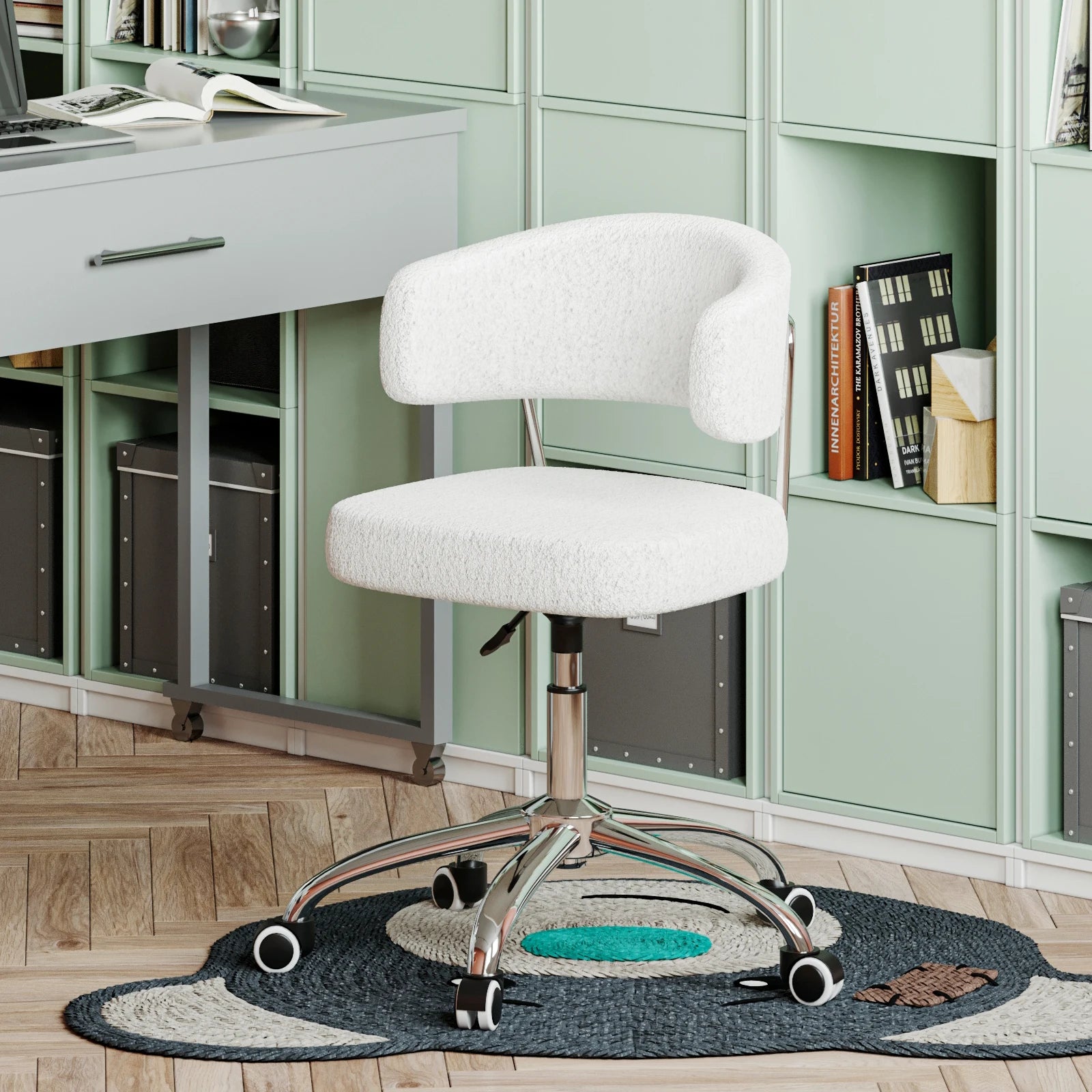 White office chair in a home office setting with green cabinets and a desk.