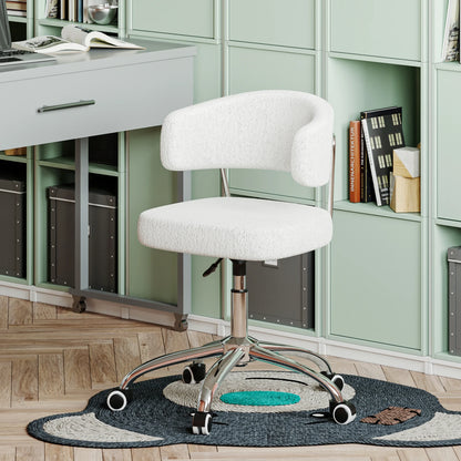 White office chair in a home office setting with green cabinets and a desk.