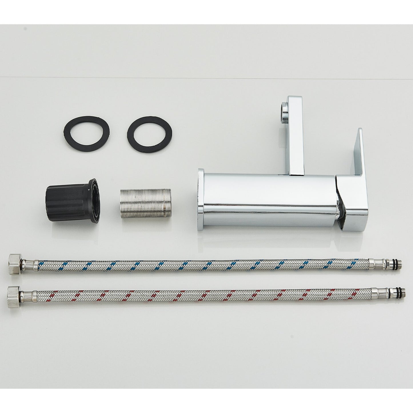 Set of plumbing components including a hose, connectors, and a valve on a white background