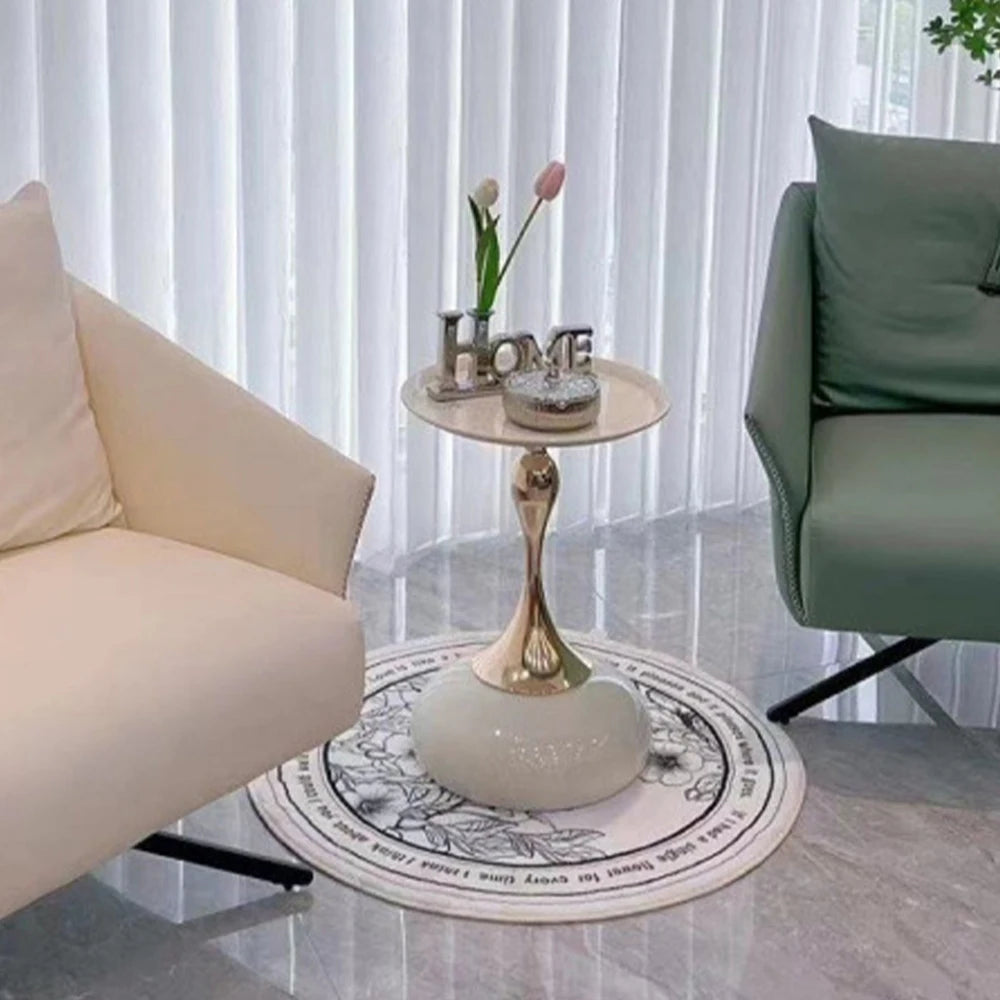 Round decorative rug with intricate patterns in a living room setting.