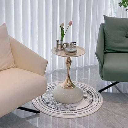 Round decorative rug with intricate patterns in a living room setting.