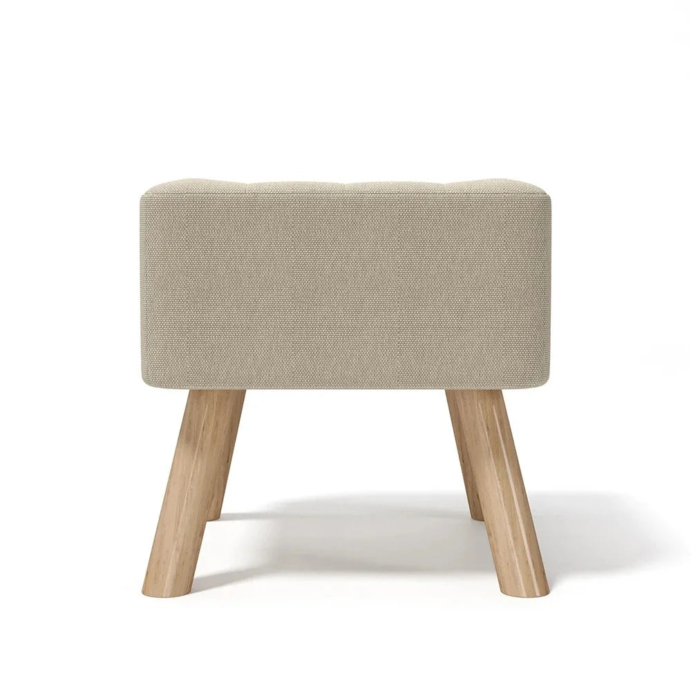 Beige ottoman with wooden legs on a white background