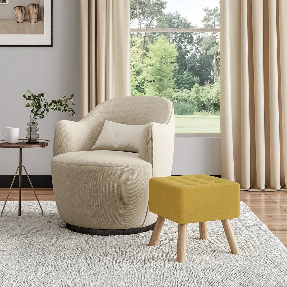 Beige armchair with a yellow ottoman in a living room setting