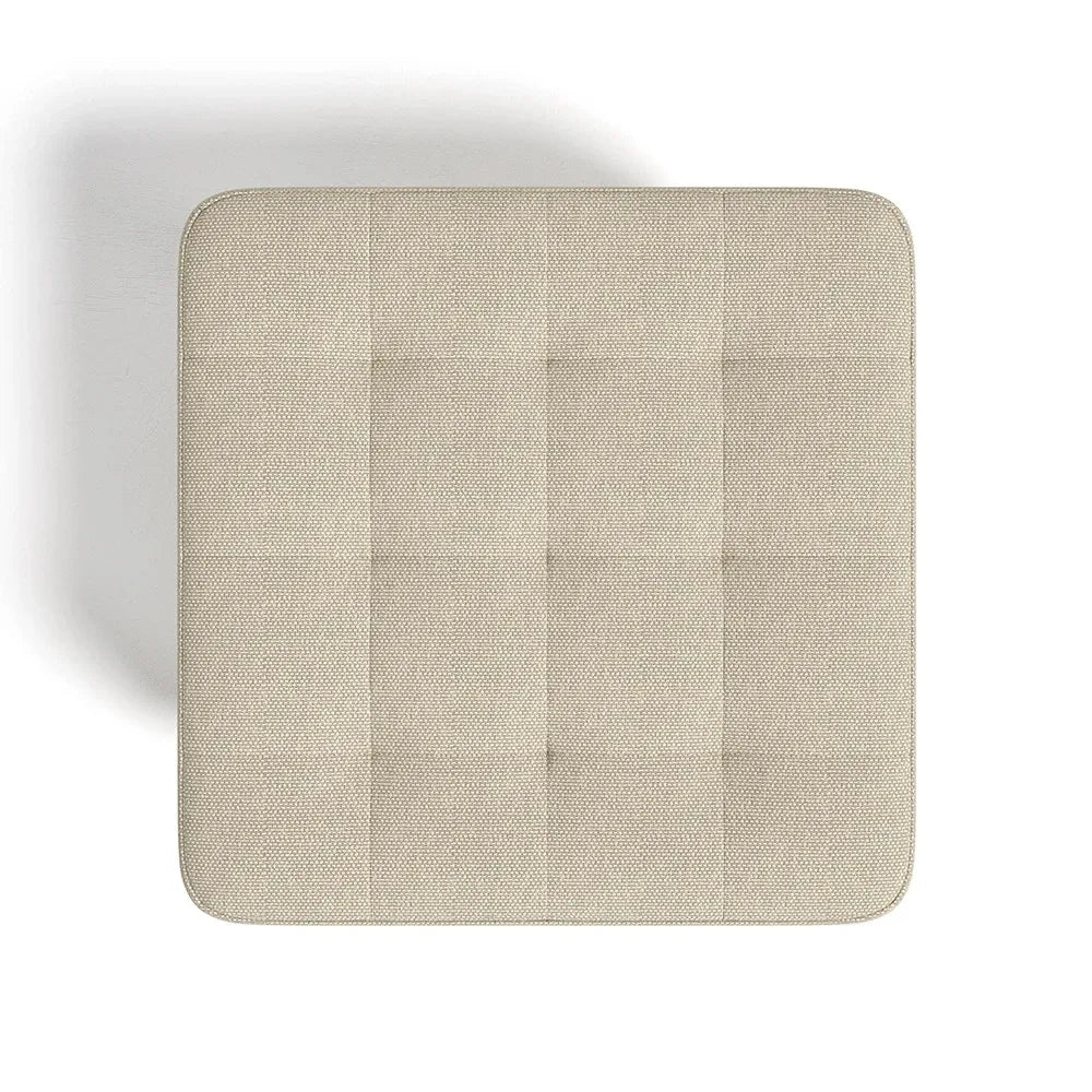 Beige square cushion on a white background