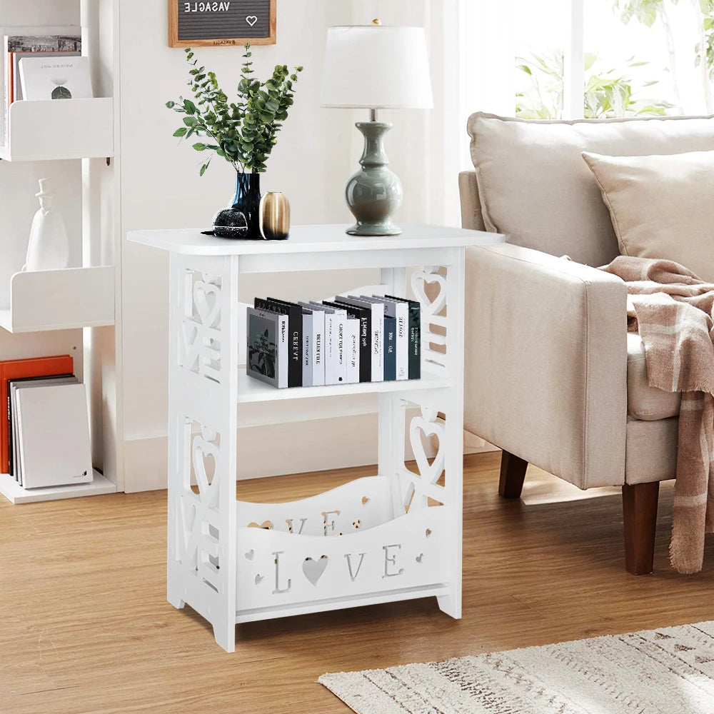 White decorative side table with cut-out designs in a living room setting.