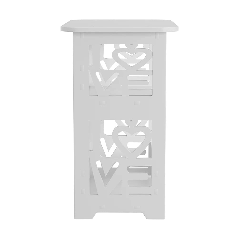 White decorative table with cut-out heart designs on a white background
