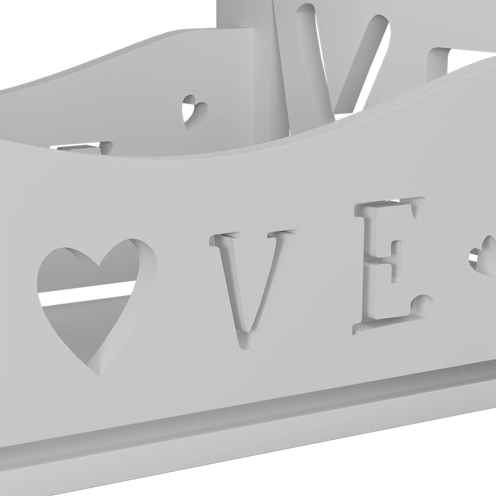 Decorative metal wall art with 'LOVE' and heart shapes cut out on a white background