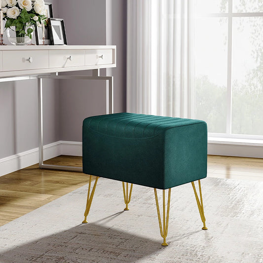 Teal ottoman with gold legs in a room setting