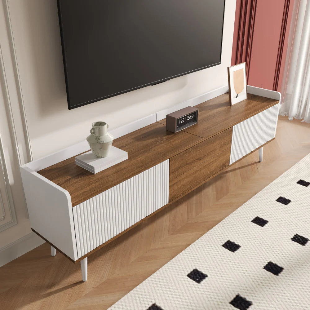 Wooden TV stand with white accents in a living room setting.