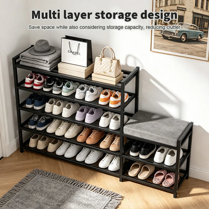 Multi-layer shoe storage rack with various shoes and a bench on a wooden floor.