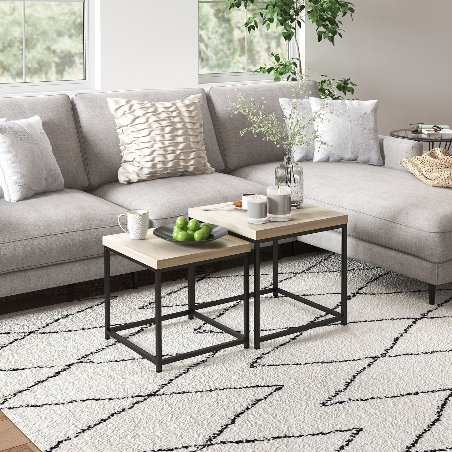 Living room with a gray sectional sofa, coffee table, and decorative items.