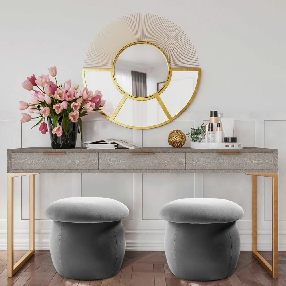 Modern interior design with a console table, decorative mirror, and stools.