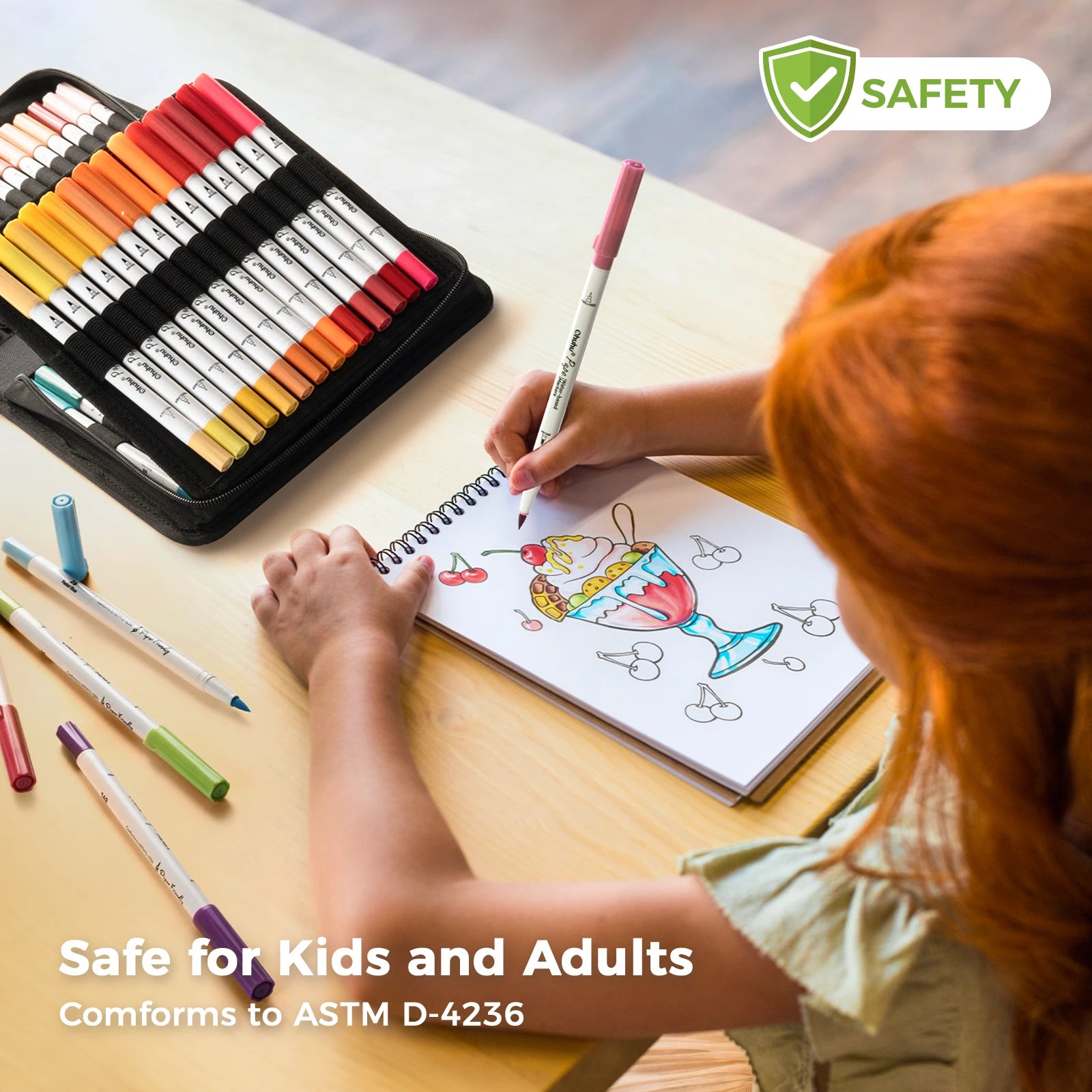 Child coloring a fish illustration with safety certified markers on a table.