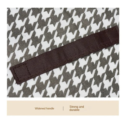 Houndstooth patterned bag with a brown handle on a beige background