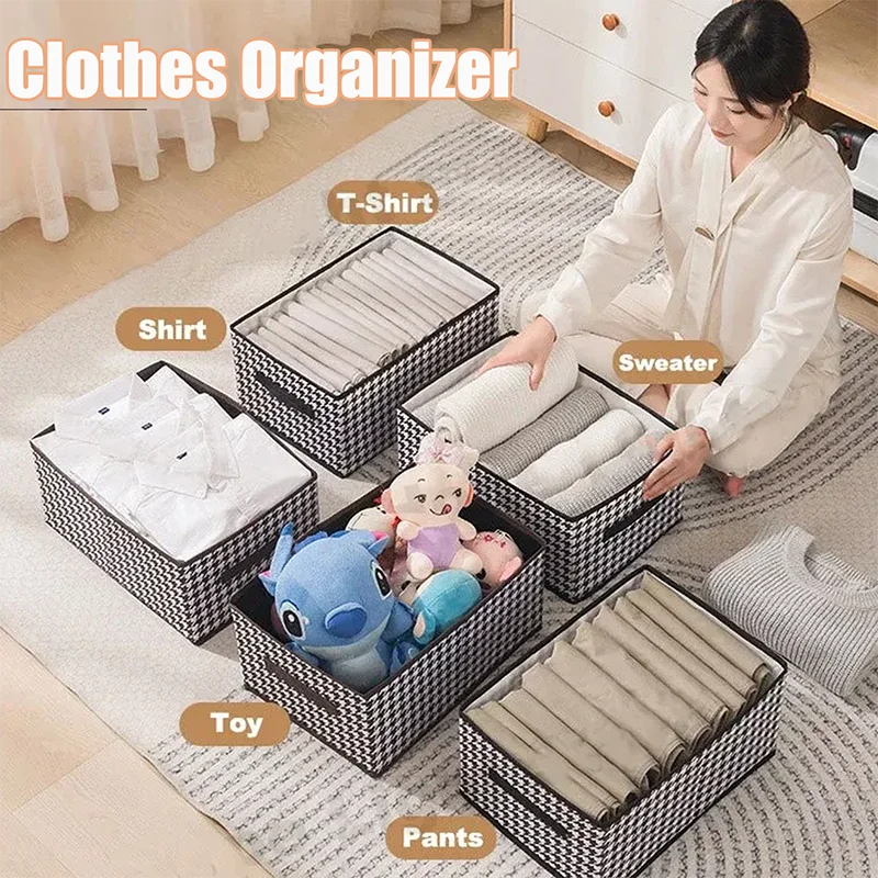 Woman organizing clothes in labeled storage bins on a carpeted floor.