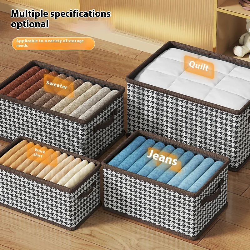 Four storage bins with labels for different types of clothing on a wooden floor.