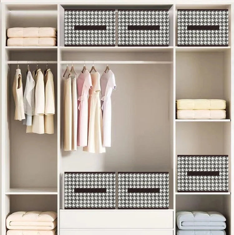 Drawer wardrobe storage box system with clothes and boxes in a neatly organized closet.