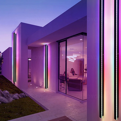 Modern house exterior with RGB outdoor lighting at dusk