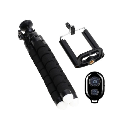 Black camera accessory set with monopod, phone holder, and remote control on a white background