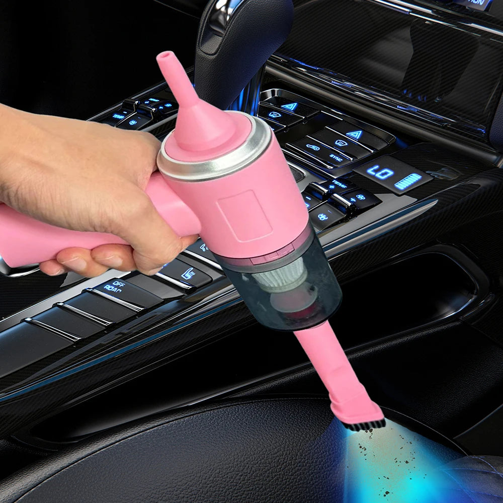 Pink car vacuum cleaner being used inside a car.