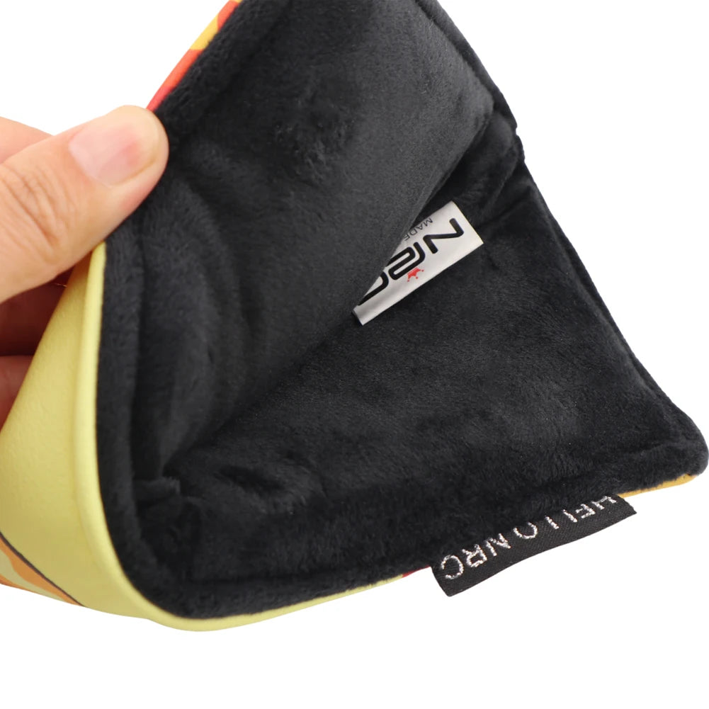 Black towel with a brand label held by a hand on a white background