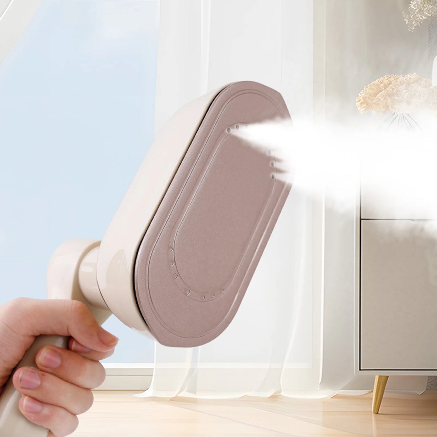 Hand holding a handheld steamer emitting steam in a room with a window and furniture.