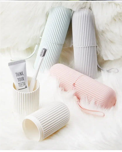 Set of ribbed cups in white, gray, and pink on a soft white background