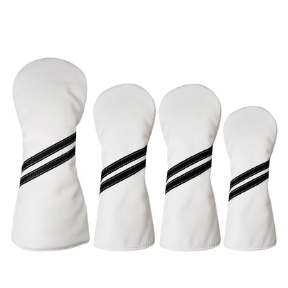 Four white golf club heads with black and white striped patterns on a white background