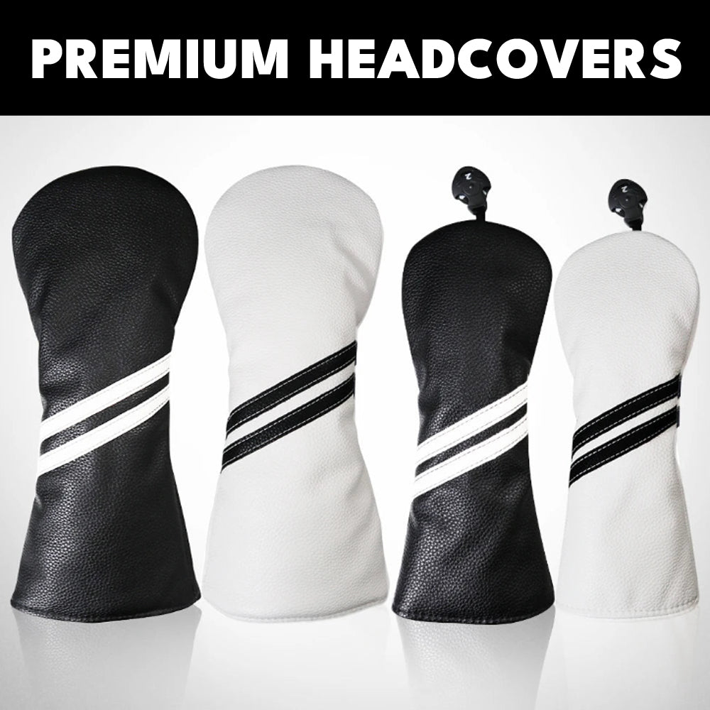 Four golf headcovers in black and white with striped design on a gray background.