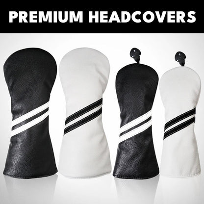Four golf headcovers in black and white with striped design on a gray background.
