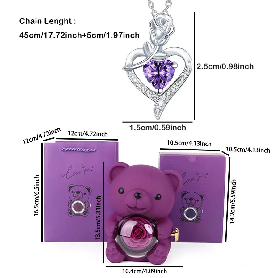 Purple teddy bear with rose and heart-shaped purple gem necklace dimensions on a white background