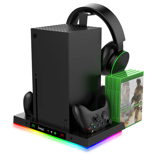 Gaming console with controller, headset, and game cases on a white background
