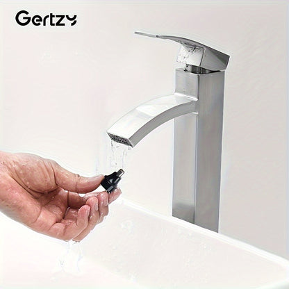 Person holding a black faucet handle in front of a silver faucet with 'Gertzy' branding.