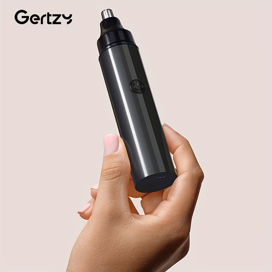 Hand holding a black electronic device with 'Gertzy' branding on a beige background