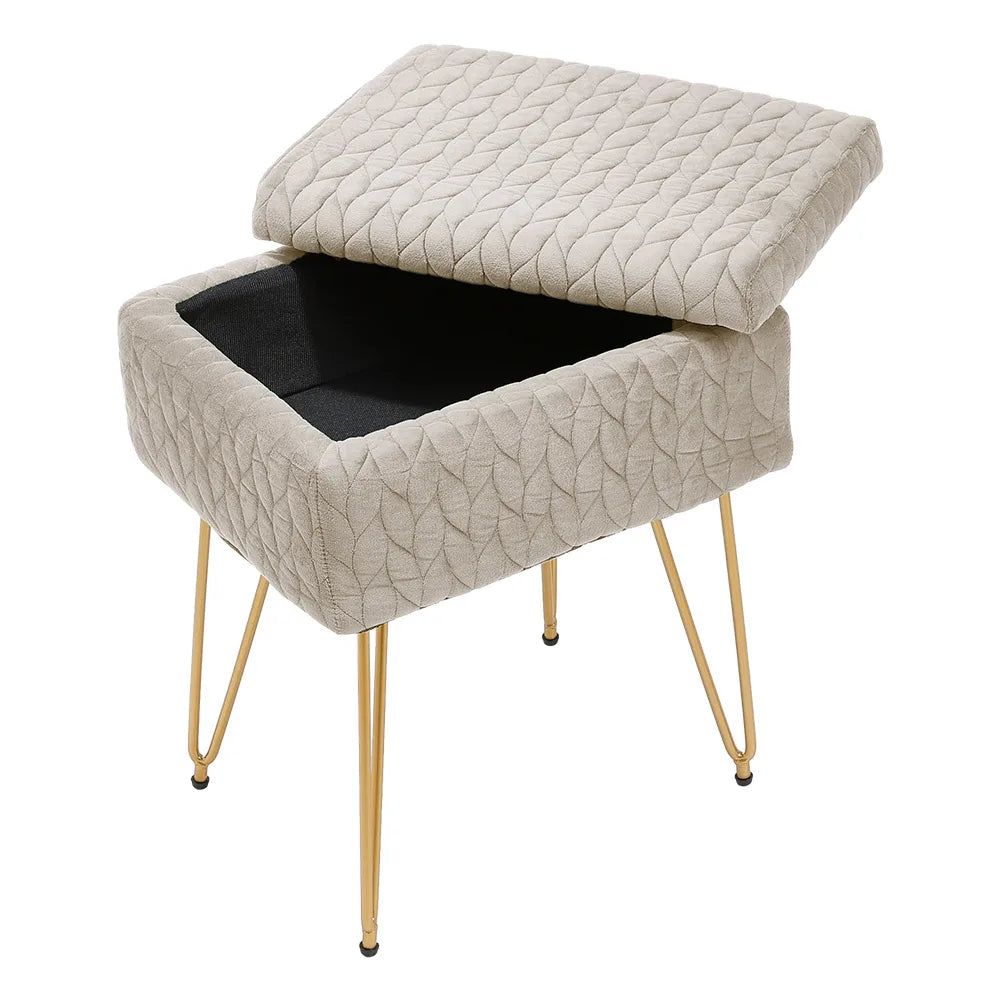 Beige textured storage ottoman with gold legs on a white background