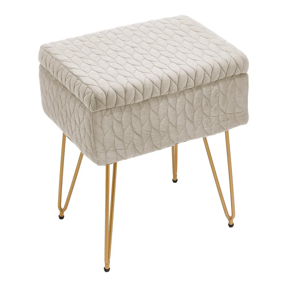 Beige textured ottoman with gold legs on a white background