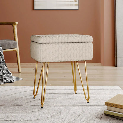 Beige tufted stool with gold legs in a room setting