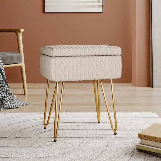 Beige tufted stool with gold legs in a room setting