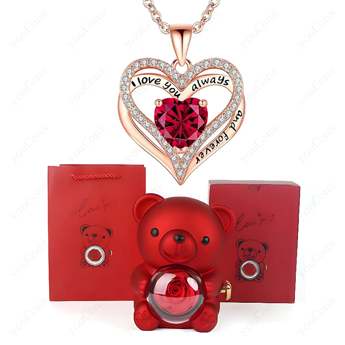 Heart-shaped necklace with red gem and rose gold accents, red teddy bear with rose, and red box on white background