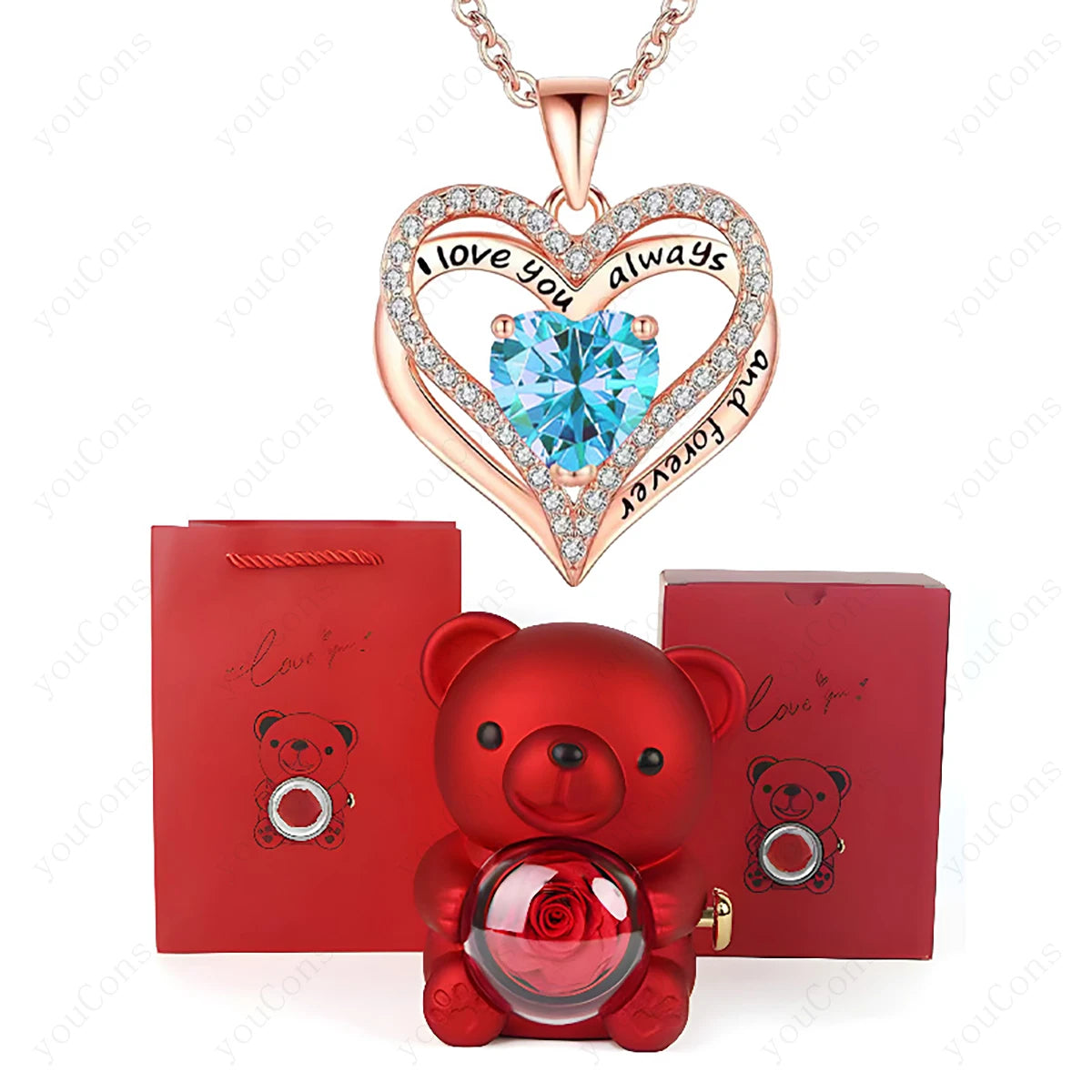 Heart-shaped necklace with blue gem and rose, red teddy bear with rose, and red box on white background