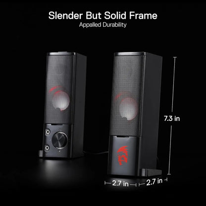 Black computer speakers with red accents on a black background, showing dimensions.