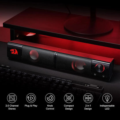 Black and red soundbar on a dark surface with product features displayed below.