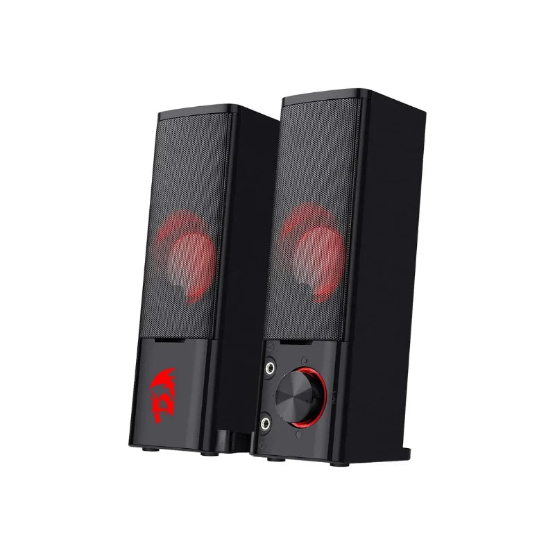 Black computer speakers with red accents on a white background
