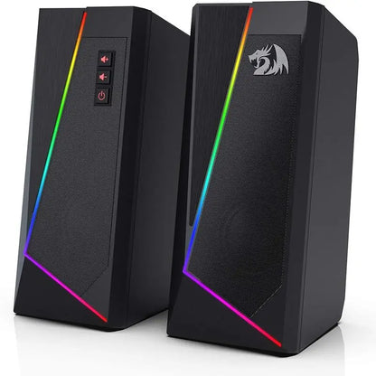 Pair of black computer speakers with RGB lighting on a white background